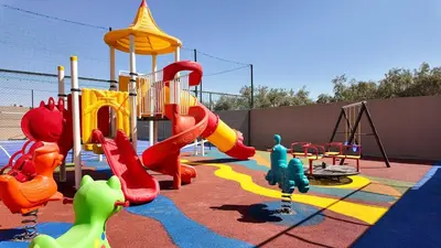 a playground with a slide and a slidesktop at Medina Bungalow - Heated Pool, not overlooked in Marrakech