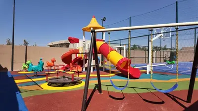 a childrens playground with a slide and a slidesktop at Medina Bungalow - Heated Pool, not overlooked in Marrakech