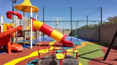 a childrens playground with a slide and a slideintend at Medina Bungalow - Heated Pool, not overlooked in Marrakech