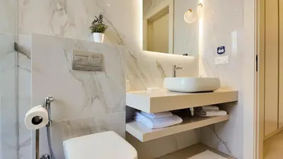 a bathroom with a sink and a mirror at Villa Maryam heated pool not overlooked in Marrakech