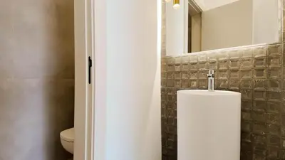 a bathroom with a toilet and a sink at Villa Maryam heated pool not overlooked in Marrakech