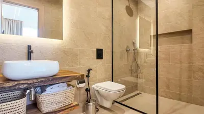 a bathroom with a toilet and a sink and a shower at Palm Grove Bungalow - Heated pool, not overlooked in Marrakech