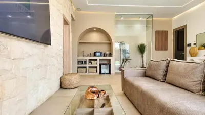 two dogs sitting on a coffee table in a living room at Palm Grove Bungalow - Heated pool, not overlooked in Marrakech