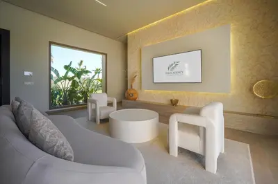 a living room with two white chairs and a couch at Villa Jibal heated pool not overlooked in Marrakech