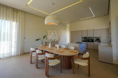a kitchen and dining room with a table and chairs at Villa Jibal heated pool not overlooked in Marrakech