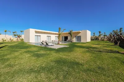 a house with a large yard in front of it at Villa Jibal heated pool not overlooked in Marrakech