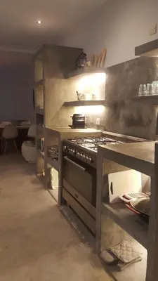 a kitchen with a stove top oven in a room at Riad Yara Farah in Marrakech