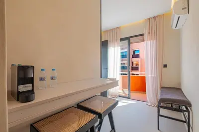 a room with two bottles of water sitting on a counter at Havre de paix moderne pour voyageurs exigeants in Marrakech