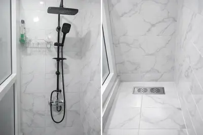 a bathroom with a shower with a shower head at Appartement 2 Chambres Marrakech Targa Parking WiFi in Marrakech