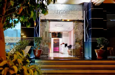 a store front with potted plants in front of it at Appart Hôtel Mouna in Marrakech