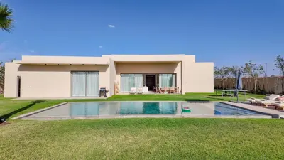 a house with a swimming pool in the yard at Villa Maréa heated pool not overlooked in Marrakech