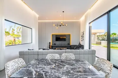 a living room with a couch and a table at Villa Prestige Privée avec Vue Splendide in Marrakech