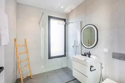 a bathroom with a sink and a mirror at Villa Prestige Privée avec Vue Splendide in Marrakech
