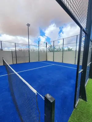 a tennis court with a net on it at Villa Prestige Privée avec Vue Splendide in Marrakech