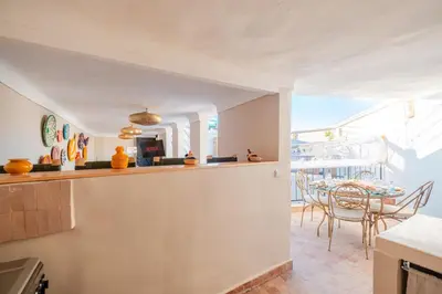 a kitchen and dining room with a table and chairs at Riad Bahia Burgos - Exclusive - Heated Pool & Breakfast - 15 min walk Jemaa El Fnaa in Marrakech