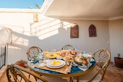 a dining room table with a turkey on it at Riad Bahia Burgos - Exclusive - Heated Pool & Breakfast - 15 min walk Jemaa El Fnaa in Marrakech