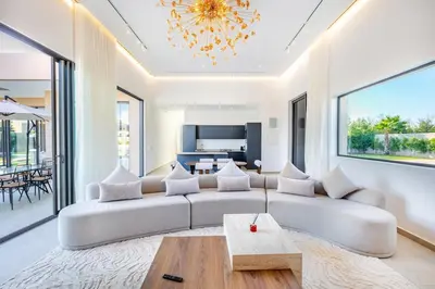 a living room with a couch and a table at Heated Pool Absolute Luxury in Marrakech