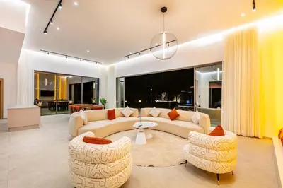 a living room with two couches and two chairs at Chic Villa Jacuzzi and Green Space in Marrakech