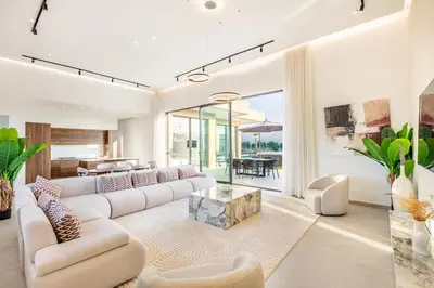a living room with a white couch and a table at Dream Getaway Intimate Villa Private Pool in Marrakech