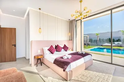 a bedroom with a large bed and a pool at Dream Getaway Intimate Villa Private Pool in Marrakech