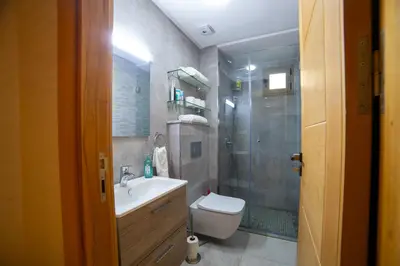 a bathroom with a shower and a toilet and a sink at Stylish &cosy 1-Bedroom in Marrakech