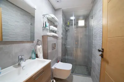 a bathroom with a shower and a sink and a toilet at Stylish &cosy 1-Bedroom in Marrakech