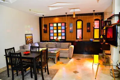 a living room with a couch and a table at Marrakech Centre Guéliz – Calme & authentique in Marrakech