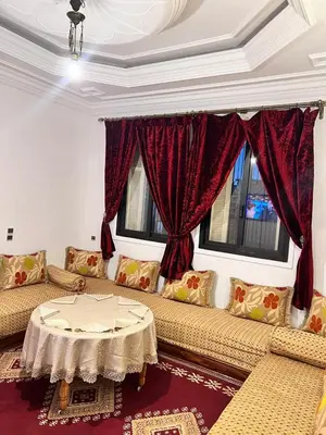 a living room with two couches and a table at Spacious Family Apartment near Jemaa el-Fnaa in Marrakech