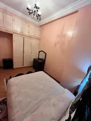 a bedroom with a bed in a room at Spacious Family Apartment near Jemaa el-Fnaa in Marrakech