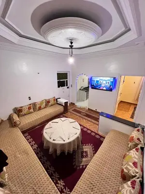 a living room with a couch and a table at Spacious Family Apartment near Jemaa el-Fnaa in Marrakech