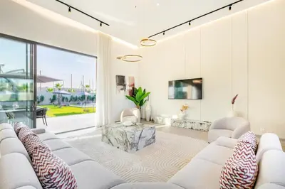 a living room with white furniture and a large window at Luxury Villa with No Overlooking 15 min from Marrakech in Marrakech