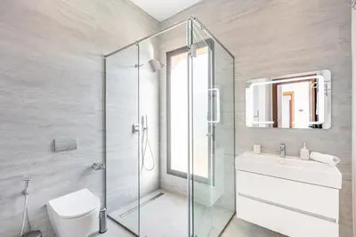 a bathroom with a shower and a toilet and a sink at Luxury Villa with No Overlooking 15 min from Marrakech in Marrakech