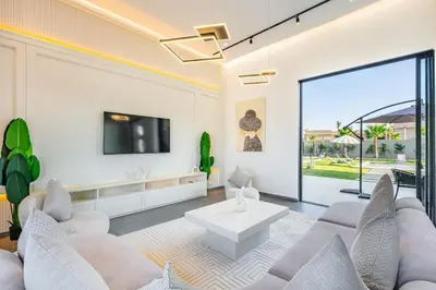 a living room with a couch and a tv at Diamond Serenity House in Marrakech