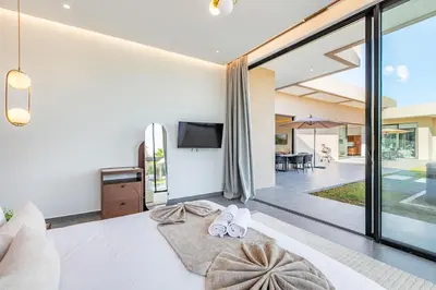 a bedroom with sliding glass doors leading to a patio at Diamond Serenity House in Marrakech