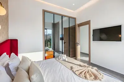a bedroom with a large bed with a flat screen tv at Diamond Serenity House in Marrakech