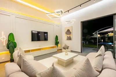 a living room with a couch and a tv at Diamond Serenity House in Marrakech