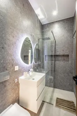 a bathroom with a white sink and a shower at Villa Magique Piscine Chauffée Et Jacuzzi in Marrakech
