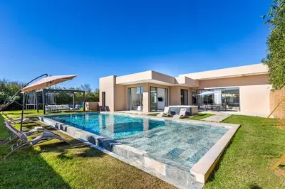 a swimming pool in the backyard of a house at Villa with jacuzzi in Marrakech