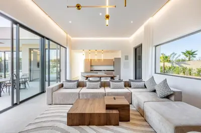 a living room with a couch and a table at Modern design and jacuzzi in Marrakech