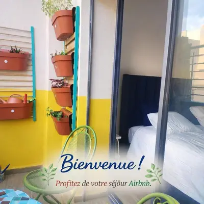 a small bedroom with a bed and potted plants at New comfy appartement-centre -Menara-Gueliz-aero in Marrakech