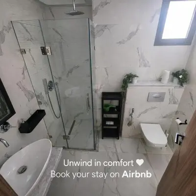 a bathroom with a shower and a sink and a toilet at New comfy appartement-centre -Menara-Gueliz-aero in Marrakech