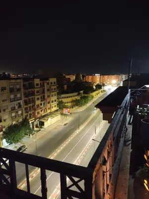 a view of a city street at night at Heart of Gueliz - Nice 2BR Flat near Train Station in Marrakech