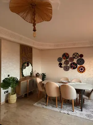 a dining room with a table and chairs at Charming Bohemian hideaway in Marrakech in Marrakech