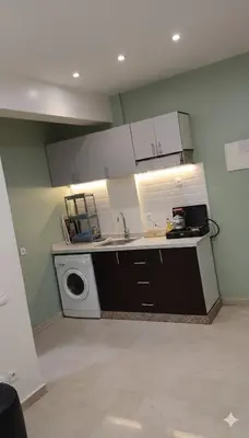 a kitchen with a sink and a washing machine at Au Cœur de L'hivernage P09 in Marrakech