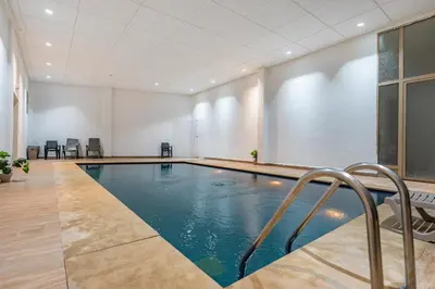a swimming pool in a large room with a pool at F2 Cozy and Swimming pool in Marrakech