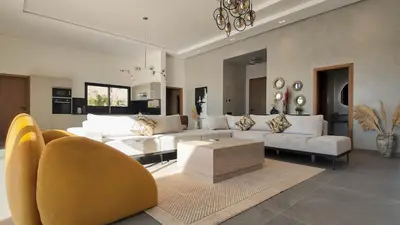 a living room with white couches and a couch at Villa Janna heated pool without overlooking in Marrakech