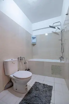 a bathroom with a toilet and a bath tub at Dar Joud in Marrakech