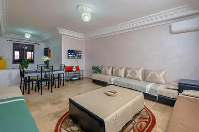 a living room with a couch and a table at Dar Joud in Marrakech