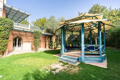 a gazebo in the yard of a house at Villa Soleil Private Pool & Garden in Marrakech