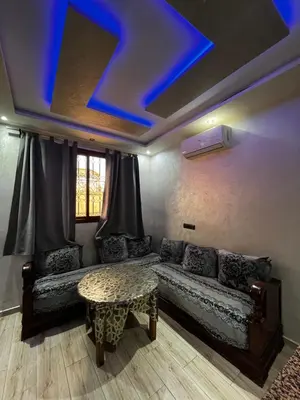a living room with a couch and a table at cozy studio in Kennaria, 1 min from Jemaa el-Fnaa in Marrakech